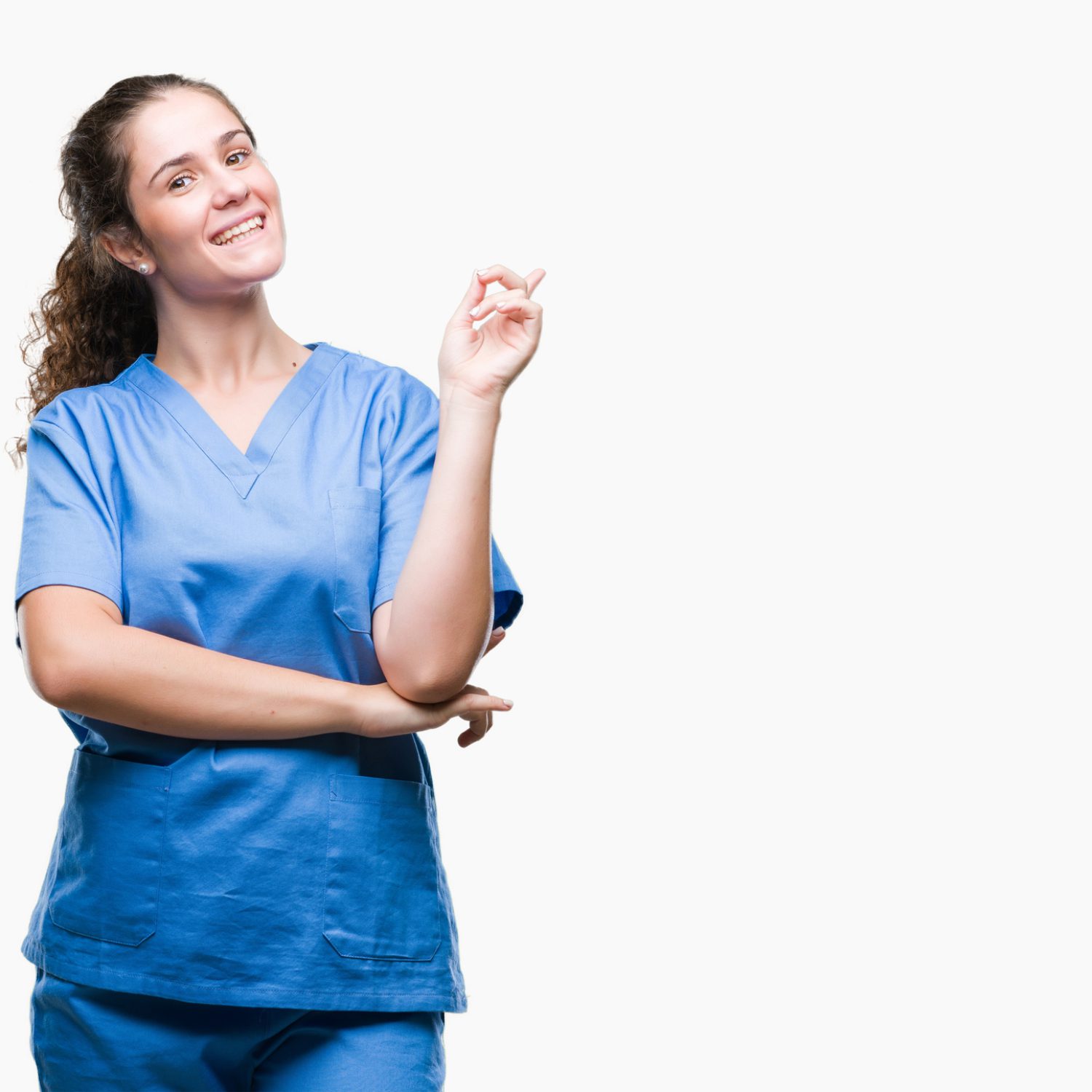 Young brunette doctor girl wearing nurse or surgeon uniform over isolated background with a big smile on face, pointing with hand and finger to the side looking at the camera.